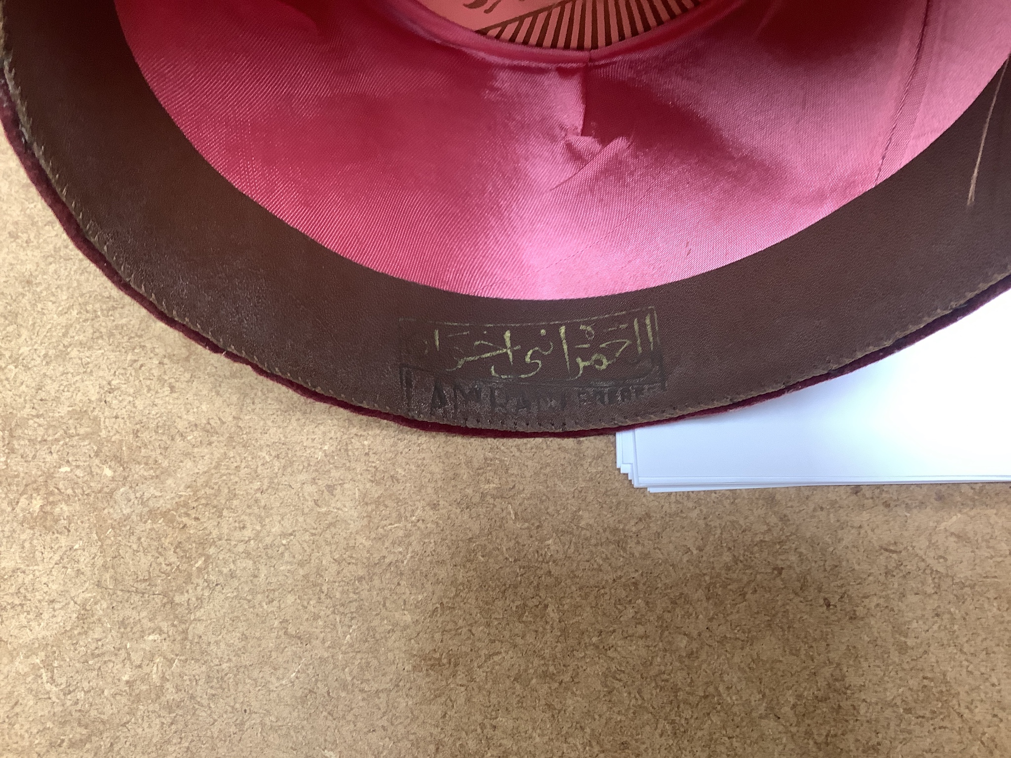 A Moroccan Fez and a Panama hat in a Dunn & Co hat box together with a hat stand